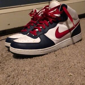 A pair of Nike high tops (red white and blue)
